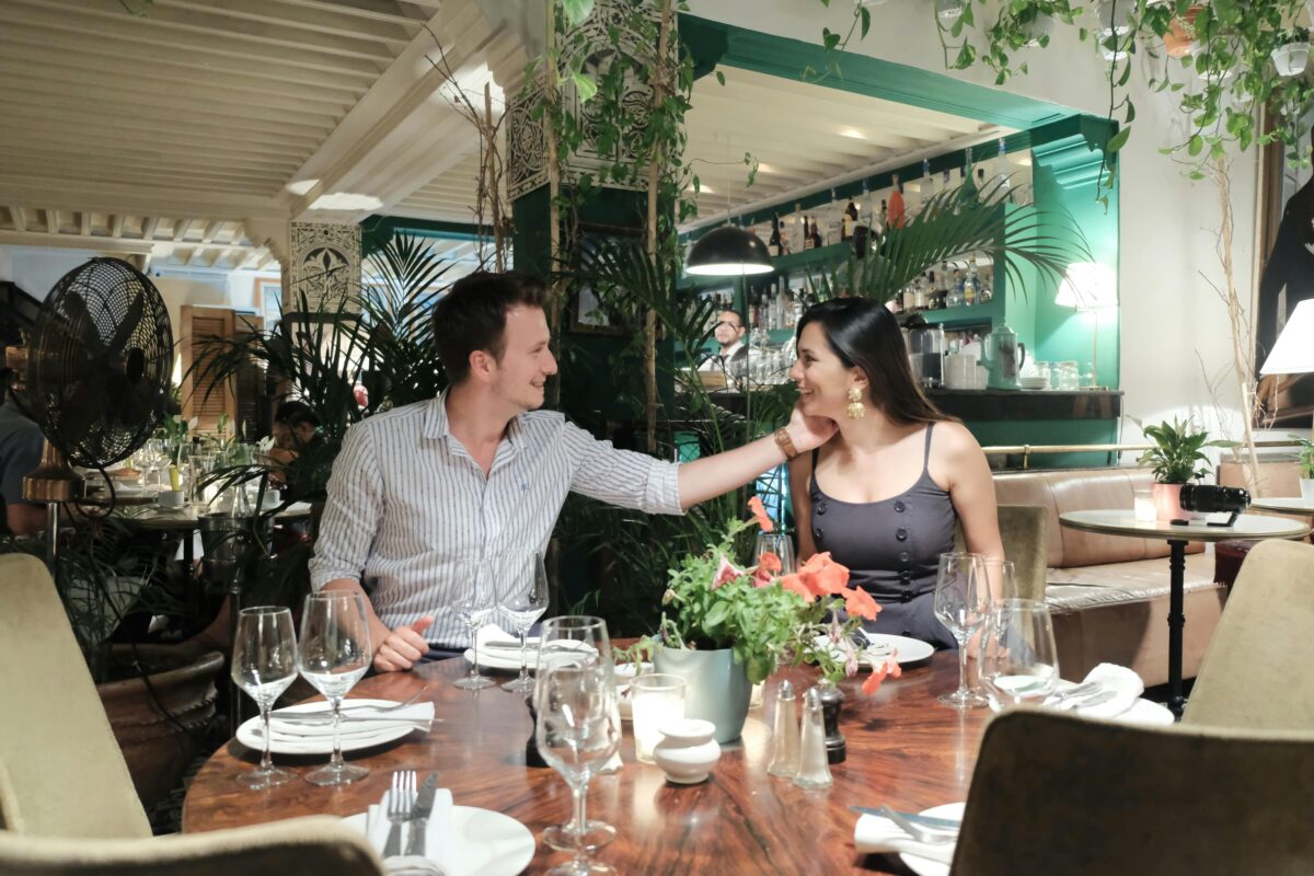Two people talking in a relaxed restaurant