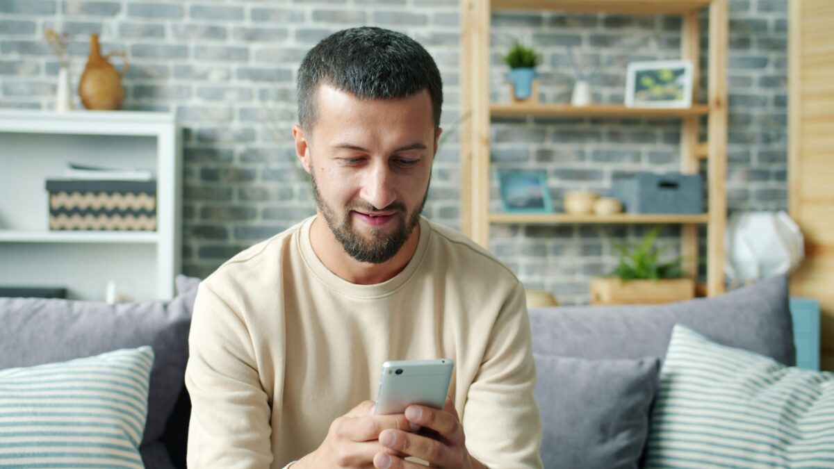 Man using phone and browsing options
