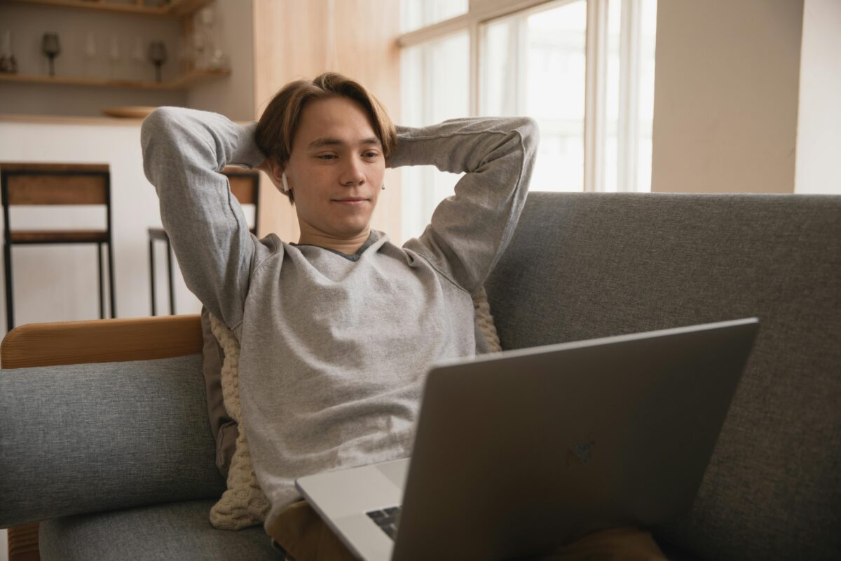 Person relaxing after browsing listings at home